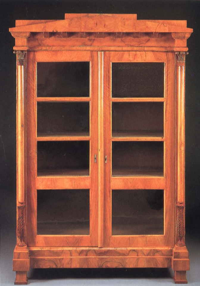 19th Century AUSTRIAN, Biedermeier Black Walnut Bookcase, 1800-1825
Walnut, 78 x 51 5/8 x 20 1/2 in. (198.1 x 131.1 x 52.1 cm)
Peaked pediment and dentiled dornice above a pair of glazed cupboard doors opening to shelves flanked by collumnar supportw with acanthus-carved capitals and terminal raised on block feet
BIE-004-FU
Appraisal Value: $0.00
User2: $0.00
User3: $0.00